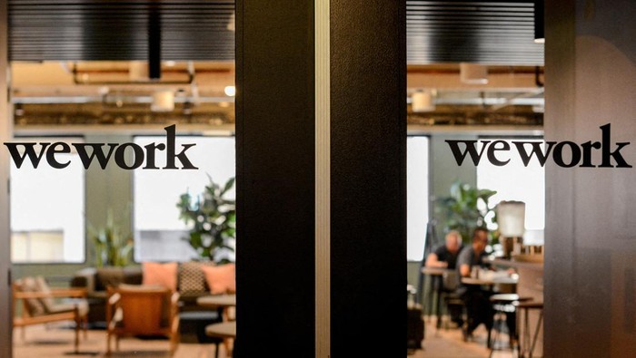 FILE PHOTO: WeWork logos are seen at a WeWork office in San Francisco, California, U.S. September 30, 2019.  REUTERS/Kate Munsch/File Photo