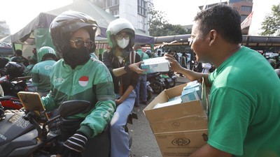 Grab Bagikan 125 Ribu Masker untuk Pengemudi dan Penumpang