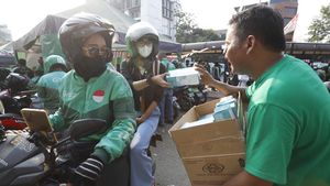 Grab Bagikan 125 Ribu Masker untuk Pengemudi dan Penumpang