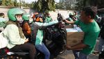 Grab Bagikan 125 Ribu Masker untuk Pengemudi dan Penumpang