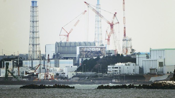 FILE - The Fukushima Daiichi nuclear power plant sits in coastal towns of both Okuma and Futaba, as seen from the Ukedo fishing port in Namie town, northeastern Japan, on March 2, 2022. Anxious about Japan’s impending release of treated nuclear wastewater from the tsunami-damaged Fukushima nuclear power plant, hundreds of South Koreans marched in their capital on Saturday, Aug. 12, 2023. Protesters called for Tokyo to abandon the plans, and expressed anger toward Seoul for endorsing the discharge despite alleged food safety risks. (AP Photo/Hiro Komae, File)
