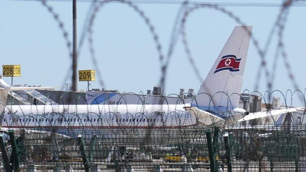 Ground crew work near an Air Koryo commercial plane on the tarmac at the Beijing Capital International Airport in Beijing, Tuesday, Aug. 22, 2023. A North Korean commercial flight has landed in Beijing amid signs that Pyongyang is opening borders again after almost three years of COVID-19 restrictions. (AP Photo/Andy Wong)