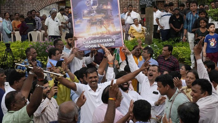 People celebrate as they watch a live telecast of the landing og Chandrayaan-3, or “moon craft” in Sanskrit, in Mumbai, India, Wednesday, Aug. 23, 2023. India has landed a spacecraft near the moon’s south pole, an unchartered territory that scientists believe could hold vital reserves of frozen water and precious elements, as the country cements its growing prowess in space and technology. (AP Photo/Rajanish Kakade)