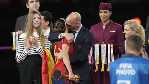 FILE - President of Spains soccer federation, Luis Rubiales, right, hugs Spains Aitana Bonmati on the podium following Spains win in the final of Womens World Cup soccer against England at Stadium Australia in Sydney, Australia, Sunday, Aug. 20, 2023. At left is Spains Princess Infanta Sofia. (AP Photo/Alessandra Tarantino, File)