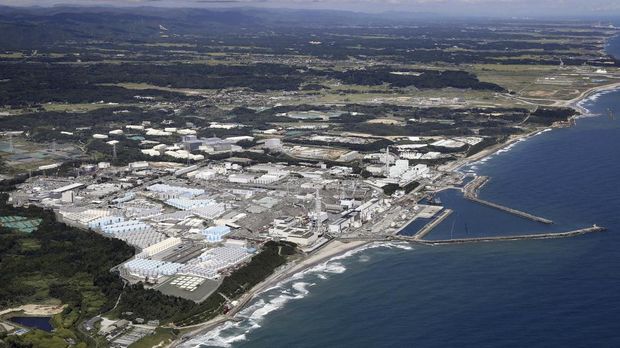 This aerial view shows the Fukushima Daiichi nuclear power plant in Fukushima, northern Japan, Thursday, Aug. 24, 2023. The operator of the tsunami-wrecked Fukushima Daiichi nuclear power plant says it has begun releasing its first batch of treated radioactive water into the Pacific Ocean — a controversial step, but a milestone for Japan's battle with the growing radioactive water stockpile.(Kyodo News via AP)
