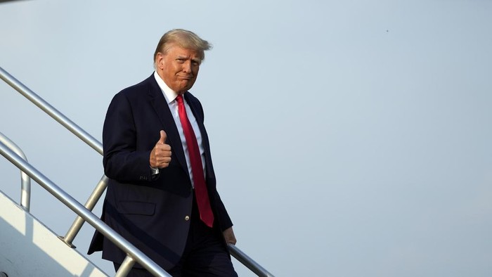 Former President Donald Trump steps off his plane as he arrives at Hartsfield-Jackson Atlanta International Airport, Thursday, Aug. 24, 2023, in Atlanta. (AP Photo/Alex Brandon)