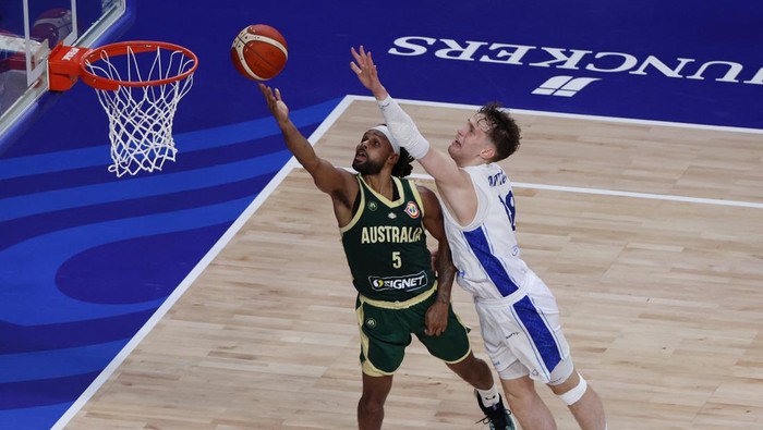 Basketball - FIBA World Cup 2023 - First Round - Group E - Finland v Australia - Okinawa Arena, Okinawa, Japan - August 25, 2023 Australias Patty Mills in action with Finlands Mikael Jantunen REUTERS/Issei Kato
