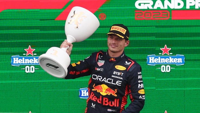 Formula One F1 - Dutch Grand Prix - Circuit Zandvoort, Zandvoort, Netherlands - August 27, 2023 Red Bulls Max Verstappen celebrates with a trophy on the on the podium after winning the Dutch Grand Prix REUTERS/Yves Herman