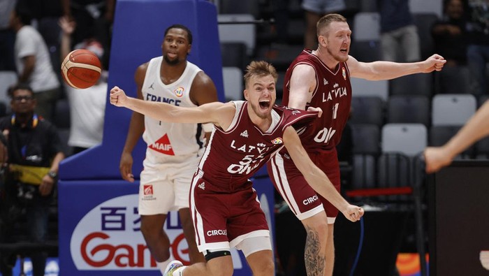 Basketball - FIBA World Cup 2023 - First Round - Group H - France v Latvia - Indonesia Arena, Jakarta, Indonesia - August 27, 2023 Latvias Arturs Zagars celebrates after the match REUTERS/Willy Kurniawan