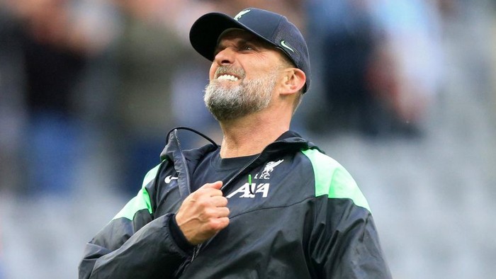 Liverpools German manager Jurgen Klopp celebrates after the final whistle during the English Premier League football match between Newcastle United and Liverpool at St James Park in Newcastle-upon-Tyne, north east England on August 27, 2023. (Photo by Lindsey Parnaby / AFP) / RESTRICTED TO EDITORIAL USE. No use with unauthorized audio, video, data, fixture lists, club/league logos or live services. Online in-match use limited to 120 images. An additional 40 images may be used in extra time. No video emulation. Social media in-match use limited to 120 images. An additional 40 images may be used in extra time. No use in betting publications, games or single club/league/player publications. /