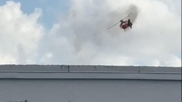 SENSITIVE MATERIAL. THIS IMAGE MAY OFFEND OR DISTURB  A helicopter on fire spins in the air before crashing into an apartment complex, in Pompano Beach, Florida, U.S., August 28, 2023, in this still image from video obtained from social media. @guiamiamivip via TMX/via REUTERS  THIS IMAGE HAS BEEN SUPPLIED BY A THIRD PARTY. MANDATORY CREDIT. NO RESALES. NO ARCHIVES.