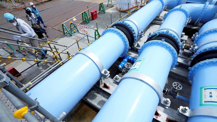 Blue pipelines to transport seawater, part of the facility for releasing treated radioactive water to sea from the Fukushima Daiichi nuclear power plant, operated by Tokyo Electric Power Company Holdings, also known as TEPCO, are seen during a treated water dilution and discharge facility tour for foreign media, in Futaba town, northeastern Japan, Sunday, Aug. 27, 2023.     Eugene Hoshiko/Pool via REUTERS