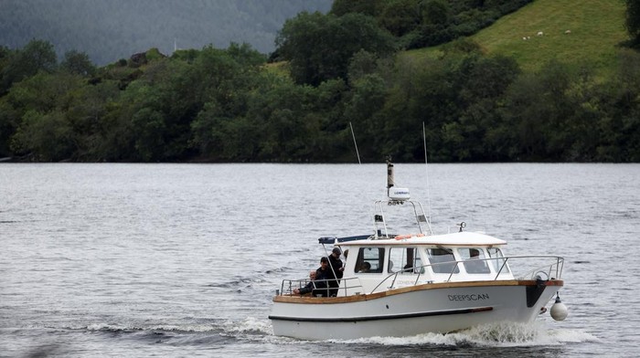 Volunteers take off in the Loch Ness Project Research Vessel, Deep Scan, as they take part in the largest Loch Ness Monster hunt for 50 years in Scotland, Britain, August 27, 2023. REUTERS/Russell Cheyne