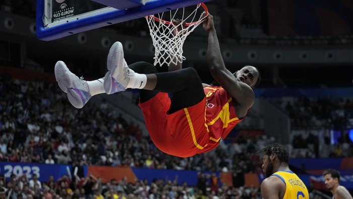 Spain forward Usman Garuba (16) dunks to score against Brazil during the Basketball World Cup group G match between Spain and Brazil at the Indonesia Arena stadium in Jakarta, Indonesia, Monday, Aug. 28, 2023. (AP Photo/Achmad Ibrahim)