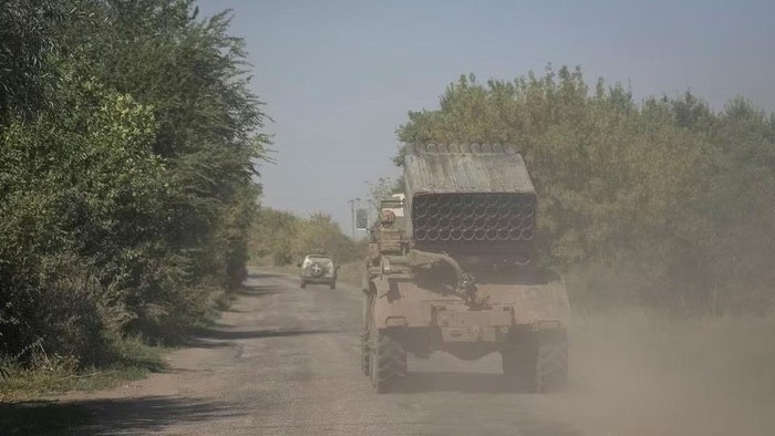 Ukrainian servicemen ride in a BM-21 Grad multiple launch rocket system near a front line, amid Russias attack on Ukraine, in Zaporizhzhia region, Ukraine August 31, 2023. REUTERS/Oleksandr Ratushniak