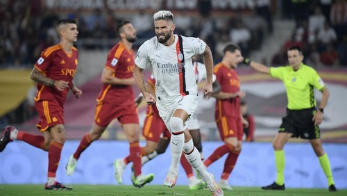 AC Milans French forward #09 Olivier Giroud celebrates scoring his teams first goal during the Italian Serie A football match between AS Roma and AC Milan at the Olympic stadium in Rome on September 1, 2023. (Photo by Filippo MONTEFORTE / AFP)