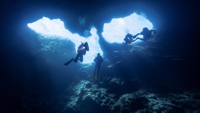 Scuba divers explore an underwater cave at the island of Brac, Croatia, September 2, 2023. REUTERS/Marko Djurica