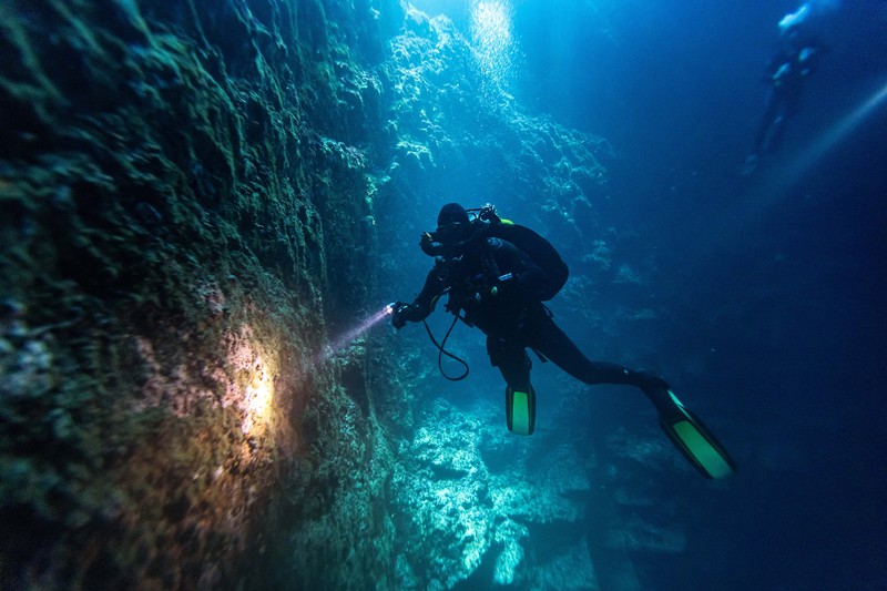 Scuba divers explore an underwater cave at the island of Brac, Croatia, September 2, 2023. REUTERS/Marko Djurica