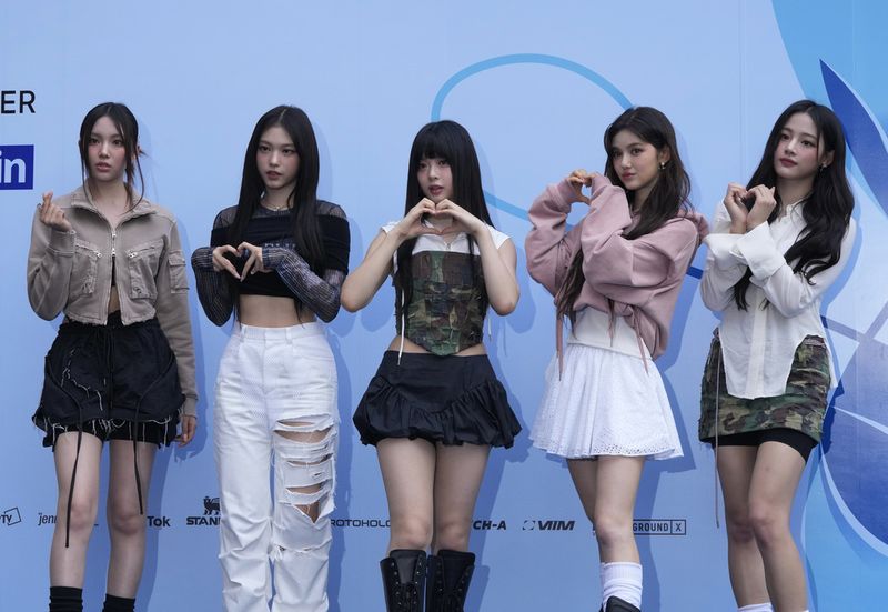 South Korean K-Pop group NewJeans members pose during the Seoul Fashion Week at Dongdaemun Design Plaza in Seoul, South Korea, Tuesday, Sept. 5, 2023. (AP Photo/Ahn Young-joon)
