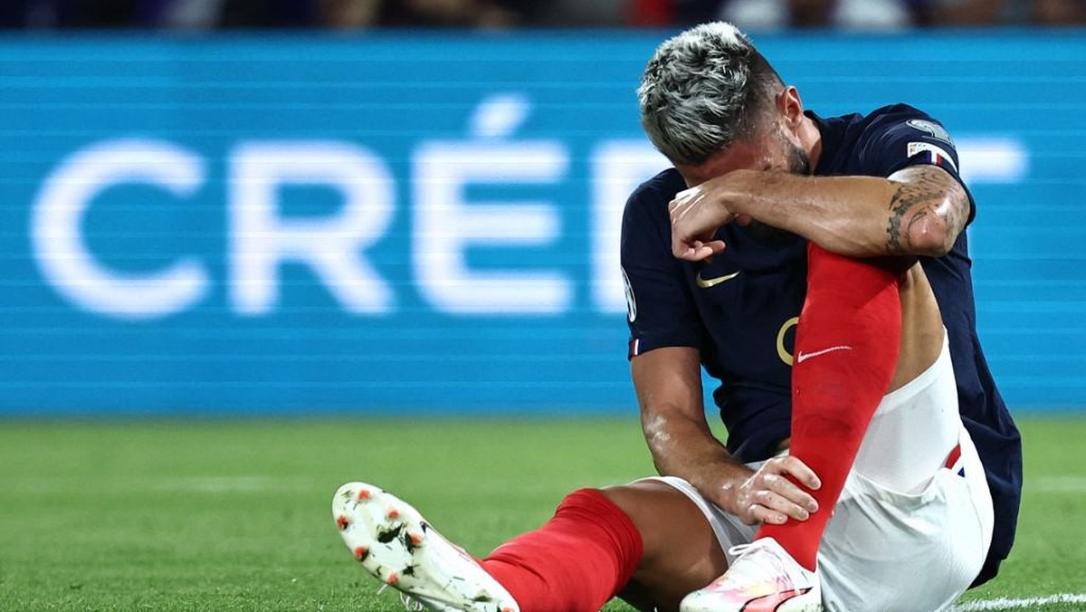 Olivier Giroud mengalami cedera engkel (AFP/ANNE-CHRISTINE POUJOULAT)