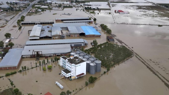 Floodwaters and mud cover the land after the country's record rainstorm, in Larrisa, Thessaly region, central Greece, Thursday, Sept. 7, 2023. The death toll from severe rainstorms that lashed parts of Greece, Turkey and Bulgaria increased after rescue teams in the three neighboring countries recovered more bodies. (AP Photo/Vaggelis Kousioras)
