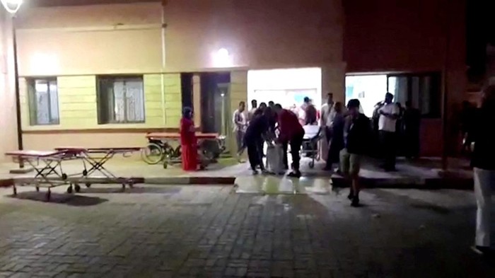 People gather outside Sidi Hsain Hospital, following a powerful quake, in Ouarzazate, Morocco, September 9, 2023 in this screen grab obtained from a handout video. Radio Sawt Ouarzazate/via Reuters TV/Handout via REUTERS    THIS IMAGE HAS BEEN SUPPLIED BY A THIRD PARTY. NO RESALES. NO ARCHIVES. MANDATORY CREDIT