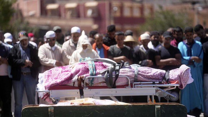 A man weeps after burying his brother who was killed by the earthquake, in Ouargane village, near Marrakech, Morocco, Saturday, Sept. 9, 2023. A rare, powerful earthquake struck Morocco, sending people racing from their beds into the streets and toppling buildings in mountainous villages and ancient cities not built to withstand such force. (AP Photo/Mosa'ab Elshamy)
