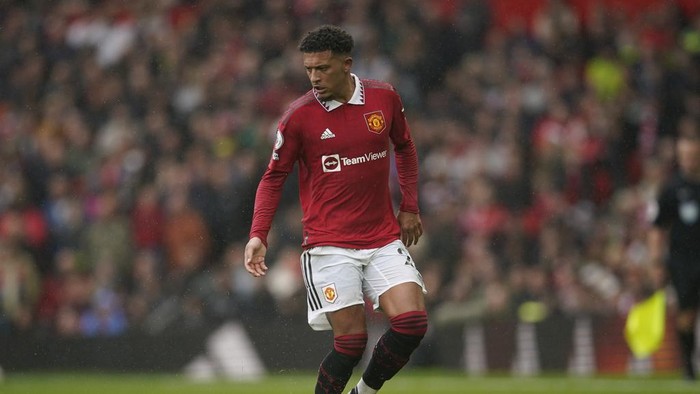 Manchester Uniteds Jadon Sancho controls the ball during the English Premier League soccer match between Manchester United and Aston Villa at the Old Trafford stadium in Manchester, England, Sunday, April 30, 2023. (AP Photo/Dave Thompson)