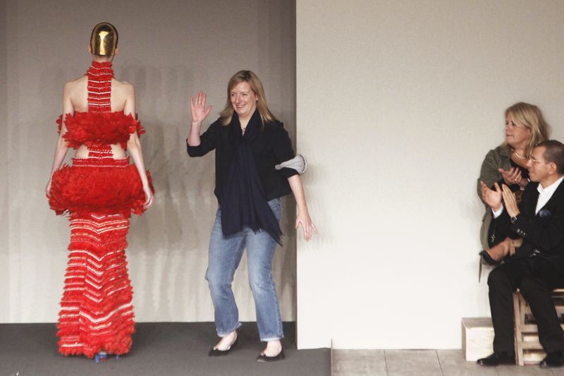 Sarah Burton Fashion designer Sarah Burton, centre, acknowledges applause following the presentation of the ready-to-wear Spring/Summer 2014 fashion collection she designed for Alexander McQueen, Tuesday, Oct. 1, 2013 in Paris. (AP Photo/Thibault Camus)