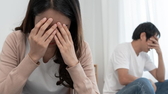 Divorce. Asian couples are desperate and disappointed after marriage. Husband and wife are sad, upset and frustrated after quarrels. distrust, love problems, betrayals. family problem, teenage love