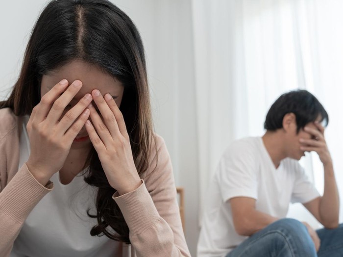 Divorce. Asian couples are desperate and disappointed after marriage. Husband and wife are sad, upset and frustrated after quarrels. distrust, love problems, betrayals. family problem, teenage love