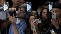 People take photos of the iPhone 15 Pro phones during an announcement of new products on the Apple campus in Cupertino, Calif., Tuesday, Sept. 12, 2023. (AP Photo/Jeff Chiu)