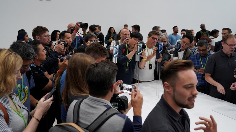 Attendees look at the new iPhone 15 Pro during the Wonderlust event at the companys headquarters in Cupertino, California, U.S. September 12, 2023. REUTERS/Loren Elliott