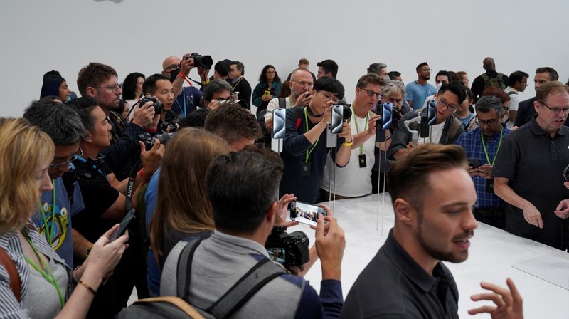 Attendees look at the new iPhone 15 Pro during the 'Wonderlust' event at the company's headquarters in Cupertino, California, U.S. September 12, 2023. REUTERS/Loren Elliott