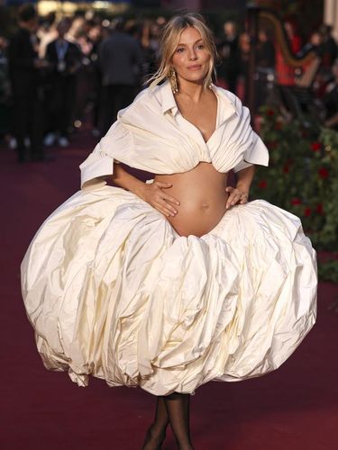 Sienna Miller poses for photographers upon arrival at the Vogue World event on Thursday, Sept. 14, 2023 in London. (Vianney Le Caer/Invision/AP)