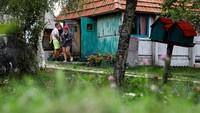 Participants leave the hut for a break, as they participate in a satirical contest to mock a popular myth that labels Montenegrins as lazy people, in the village of Brezna, Pluzine, Montenegro, September 6, 2023. REUTERS/Stevo Vasiljevic
Satirical contest for Laziest Citizen in Montenegro