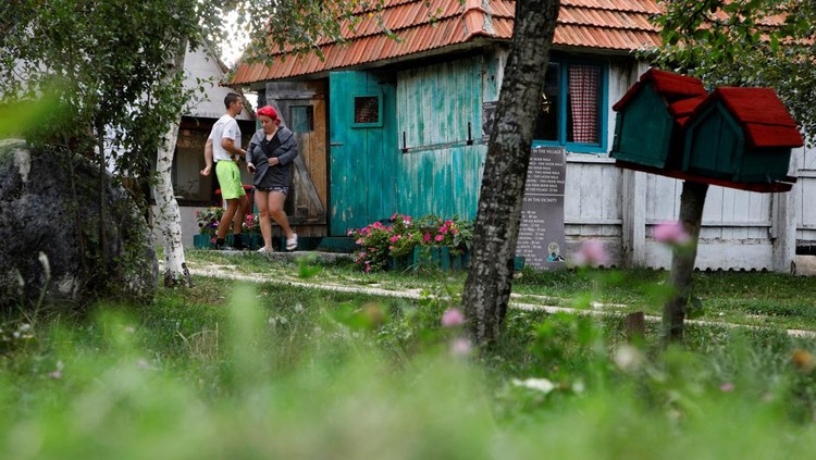 Participants leave the hut for a break, as they participate in a satirical contest to mock a popular myth that labels Montenegrins as lazy people, in the village of Brezna, Pluzine, Montenegro, September 6, 2023. REUTERS/Stevo Vasiljevic
Satirical contest for Laziest Citizen in Montenegro