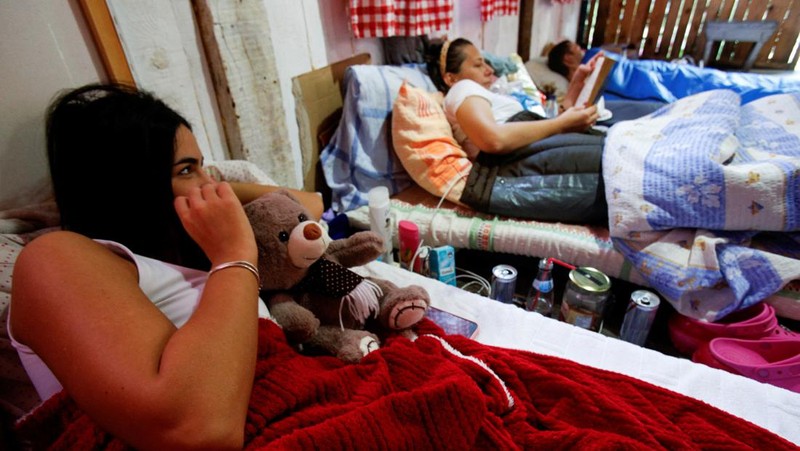 Participants leave the hut for a break, as they participate in a satirical contest to mock a popular myth that labels Montenegrins as lazy people, in the village of Brezna, Pluzine, Montenegro, September 6, 2023. REUTERS/Stevo Vasiljevic
Satirical contest for 