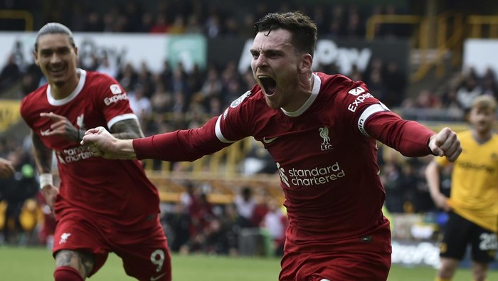Liverpools Andrew Robertson celebrates after scoring his sides second goal during the English Premier League soccer match between Wolverhampton and Liverpool at the Molineux stadium in Wolverhampton, England, Saturday, Sept. 16, 2023. (AP Photo/Rui Vieira)