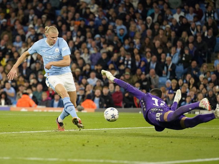 Red Star's goalkeeper Omri Glazer saves a shot from Manchester City's Erling Haaland during the Champions League group G soccer match between Manchester City and Red Star Belgrade in Manchester, England, Tuesday Sept. 19, 2023. (AP Photo/Dave Thompson)
