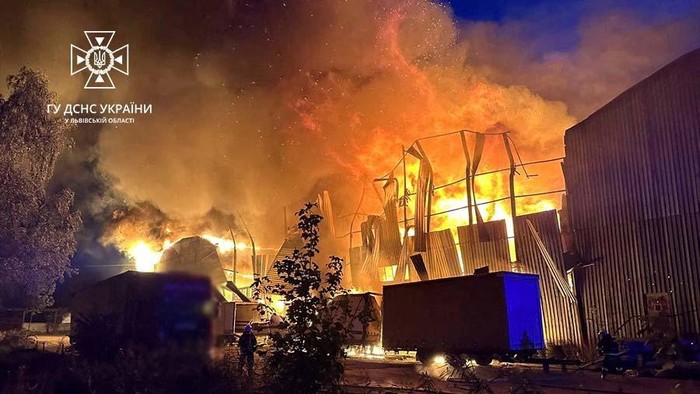 Firefighters work at a site of an industrial warehouse damaged by a Russian drone strike, amid Russia's attack on Ukraine, in Lviv, Ukraine September 19, 2023. Press service of the State Emergency Service of Ukraine in Lviv region/Handout via REUTERS ATTENTION EDITORS - THIS IMAGE HAS BEEN SUPPLIED BY A THIRD PARTY. DO NOT OBSCURE LOGO.