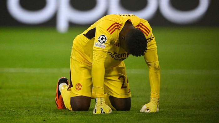 Manchester Uniteds Cameroonian goalkeeper #24 Andre Onana reacts after conceding the opening goal during the UEFA Champions League Group A football match FC Bayern Munich v Manchester United in Munich, southern Germany on September 20, 2023. (Photo by Tobias SCHWARZ / AFP)