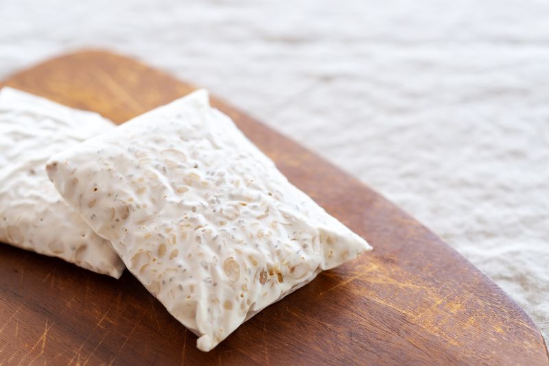 homemade Tempeh on wooden cutting board