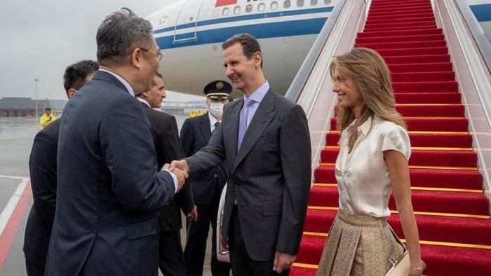 Syrias President Bashar al-Assad and his wife Asma are welcomed upon their arrival at Hangzhou airport, China in this handout picture obtained by Reuters on September 21, 2023. Syrian Presidency/Handout via Reuters
