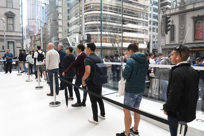 SYDNEY, AUSTRALIA - SEPTEMBER 22: Customers wait in line at the Australian release of the latest iPhone and Apple Watch models at the Apple Store on September 22, 2023 in Sydney, Australia. Apple launched its lineup of the latest iPhone 15 versions as well as other product upgrades such as the Apple Watch Series 9 and Apple Watch Ultra 2 feauturing new design, improved performance and new materials.  (Photo by James D. Morgan/Getty Images)