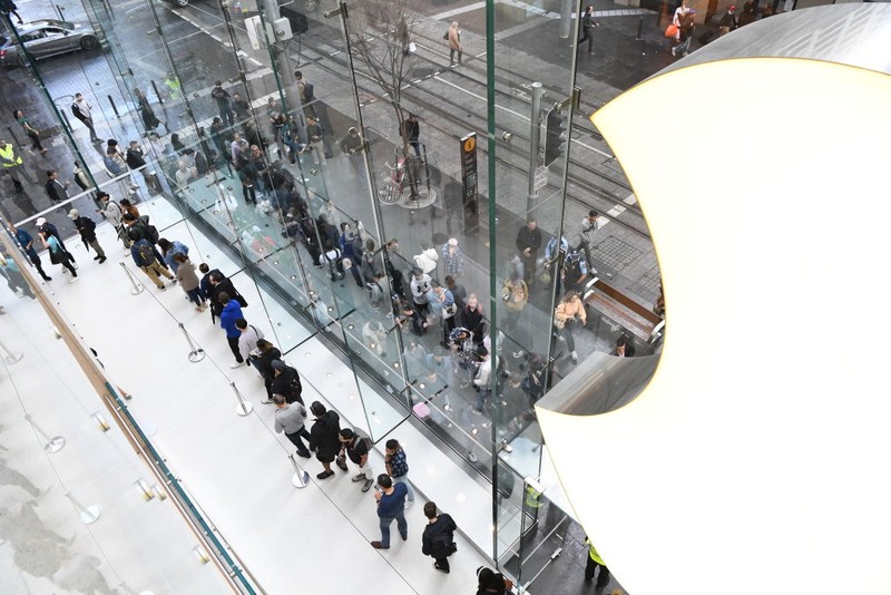 SYDNEY, AUSTRALIA - SEPTEMBER 22: Customers wait in line at the Australian release of the latest iPhone and Apple Watch models at the Apple Store on September 22, 2023 in Sydney, Australia. Apple launched its lineup of the latest iPhone 15 versions as well as other product upgrades such as the Apple Watch Series 9 and Apple Watch Ultra 2 feauturing new design, improved performance and new materials.  (Photo by James D. Morgan/Getty Images)