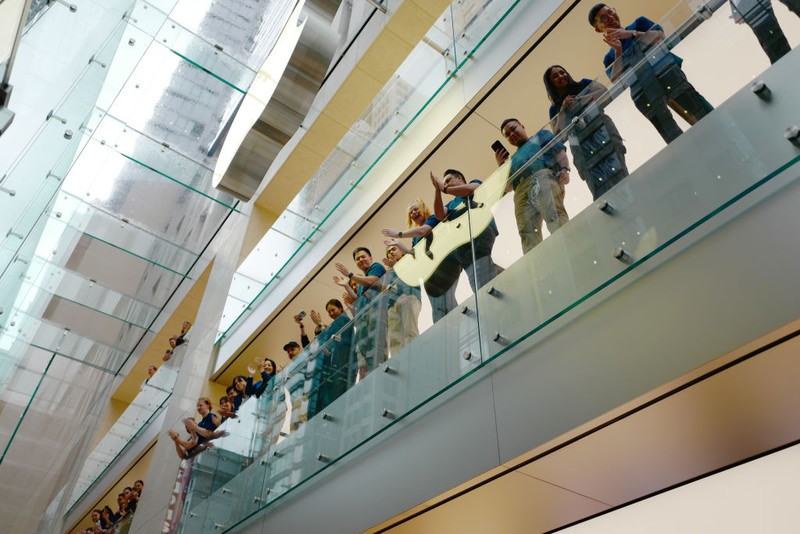 SYDNEY, AUSTRALIA - SEPTEMBER 22: Customers wait in line at the Australian release of the latest iPhone and Apple Watch models at the Apple Store on September 22, 2023 in Sydney, Australia. Apple launched its lineup of the latest iPhone 15 versions as well as other product upgrades such as the Apple Watch Series 9 and Apple Watch Ultra 2 feauturing new design, improved performance and new materials.  (Photo by James D. Morgan/Getty Images)