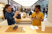 SYDNEY, AUSTRALIA - SEPTEMBER 22: Customers wait in line at the Australian release of the latest iPhone and Apple Watch models at the Apple Store on September 22, 2023 in Sydney, Australia. Apple launched its lineup of the latest iPhone 15 versions as well as other product upgrades such as the Apple Watch Series 9 and Apple Watch Ultra 2 feauturing new design, improved performance and new materials.  (Photo by James D. Morgan/Getty Images)