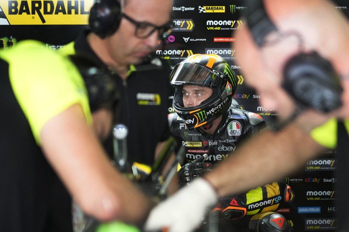 Mooney VR46 Racing Team (Ducati) team member Luca Marini take a quick break at Pit lane during MotoGP practice session at the Buddh International Circuit in Greater Noida, on the outskirts of New Delhi, India Friday, Sept. 22, 2023. (AP Photo/Manish Swarup)