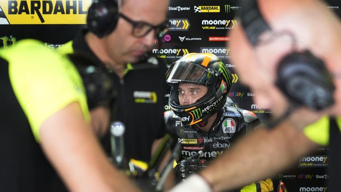 Mooney VR46 Racing Team (Ducati) team member Luca Marini take a quick break at Pit lane during MotoGP practice session at the Buddh International Circuit in Greater Noida, on the outskirts of New Delhi, India Friday, Sept. 22, 2023. (AP Photo/Manish Swarup)